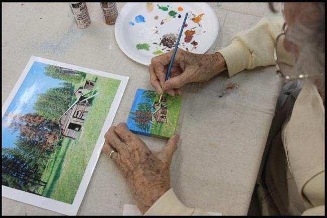 Lady painting at Florida Wildflower Studios