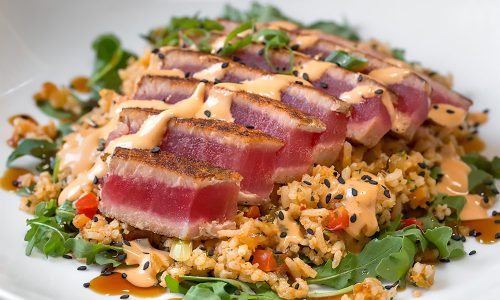 blackened tuna over rice at Harry's Seafood Bar and Grille in Lakeland, FL