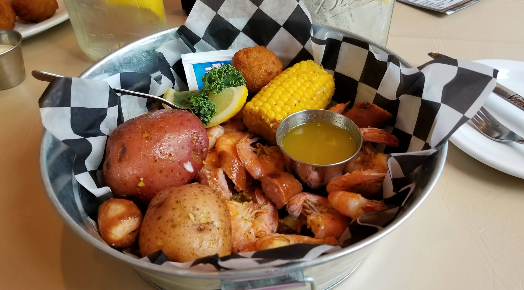 potatoes, corn on the cob, shrimp and butter. Seafood boil bowl at Harry's Old Place in Winter Have, FL