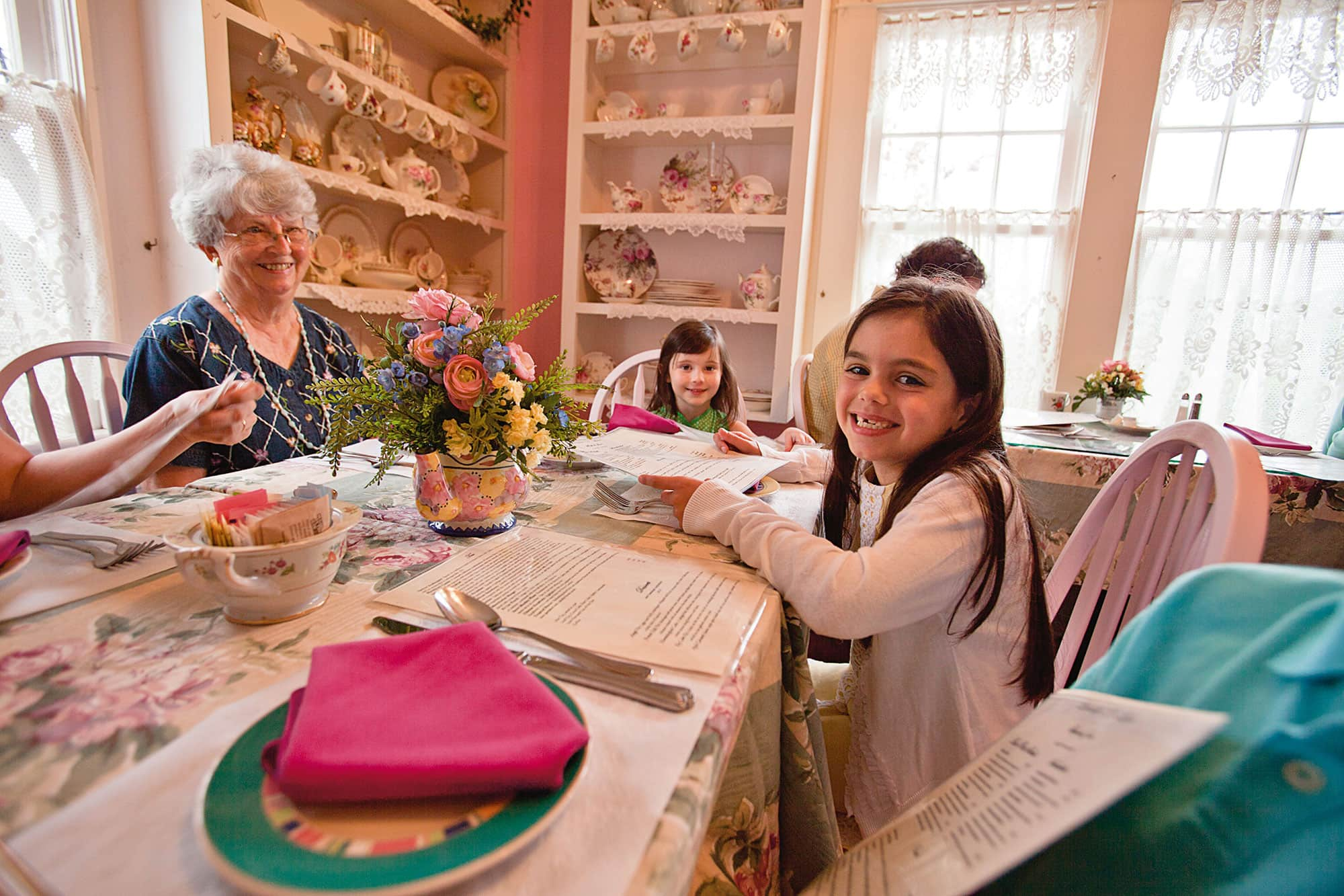 Young girl having lunch with grandma and siblings at Lavender N Lace Tea Room in Lake Alfred, FL