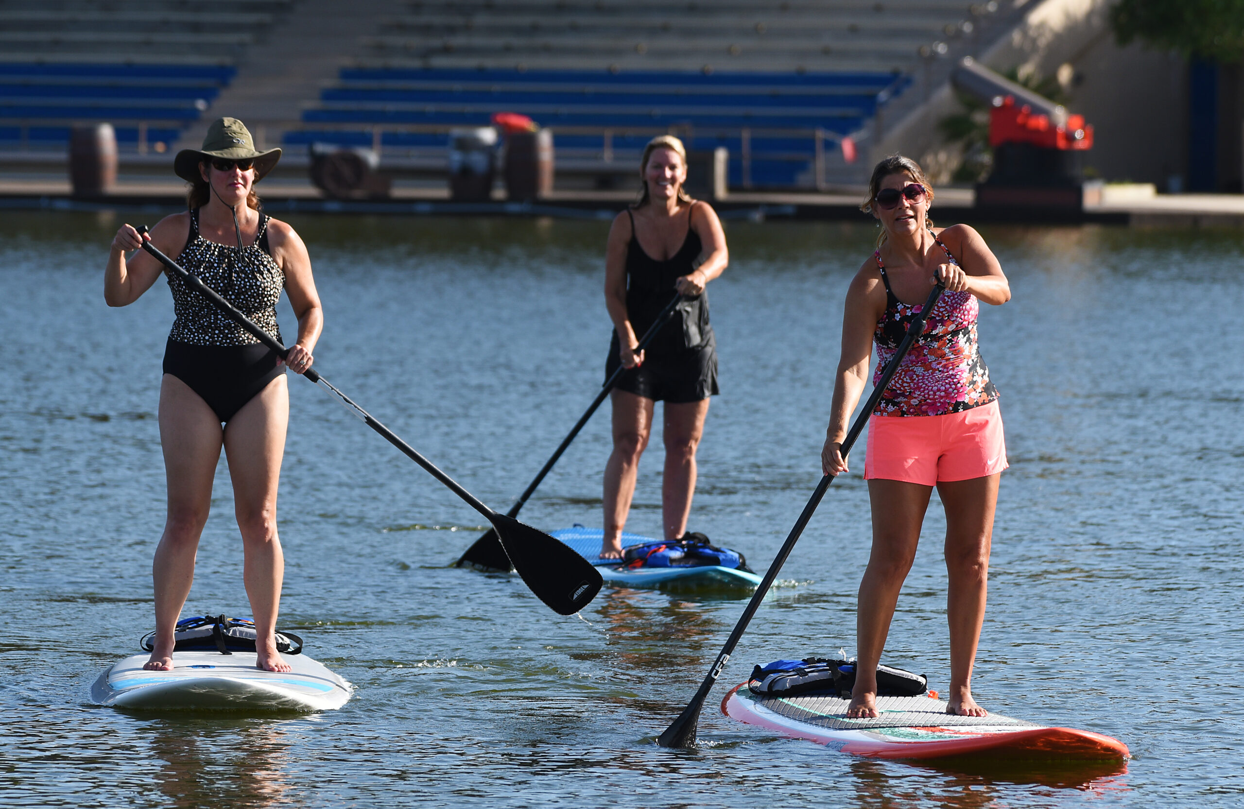 3 girls paddle boarding in winter haven