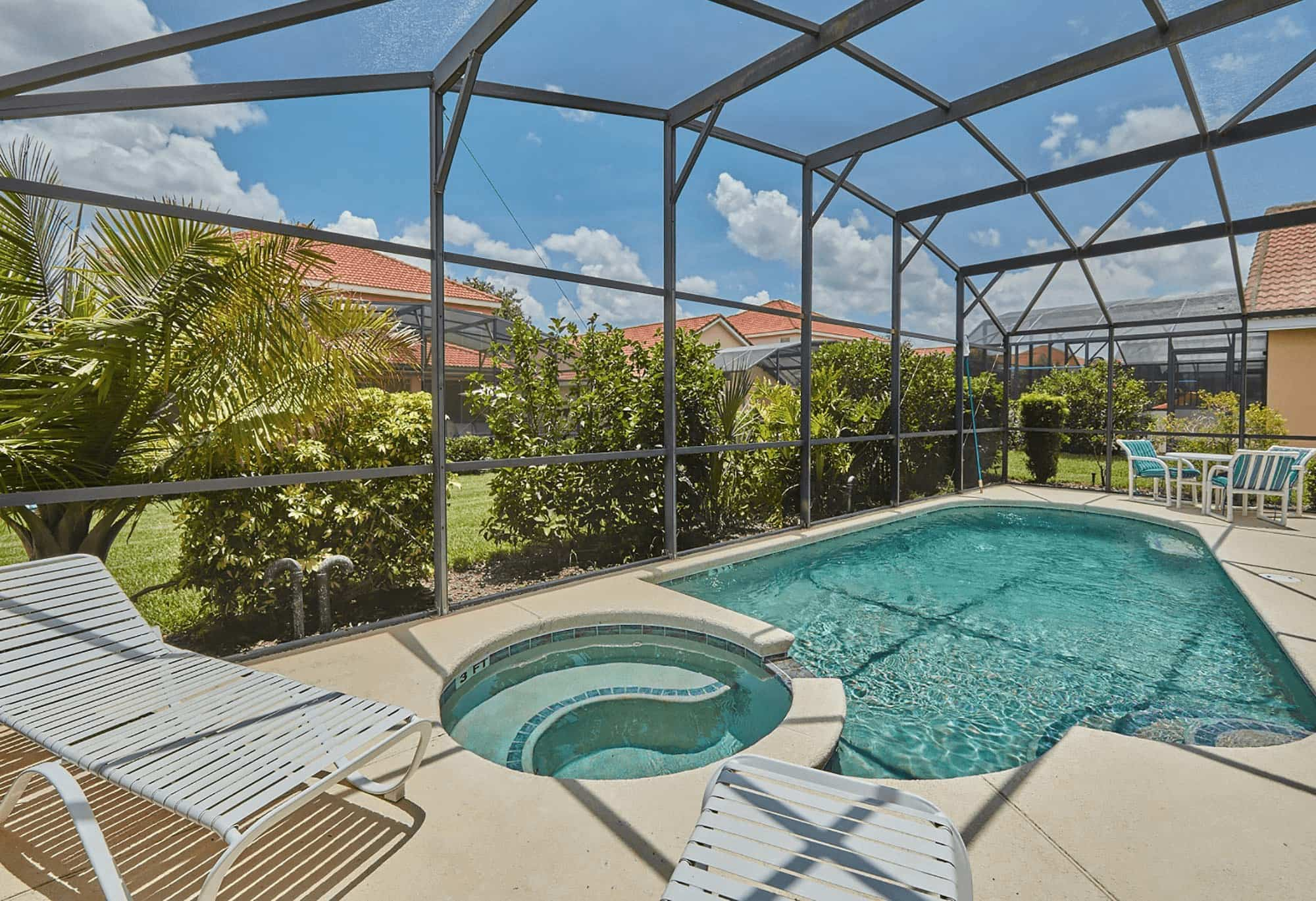 Pool and hot tub area of Welcome Homes USA vacation rental home in Davenport